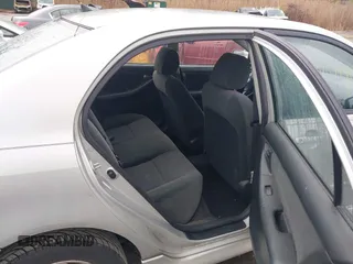 2003 Toyota Corolla CE with VIN 2T1BR32E13C038971, listed as a IAAI auction lot 42027458 with 227,808 mi miles. Bid and sale history available at carsss.com. Image 8.