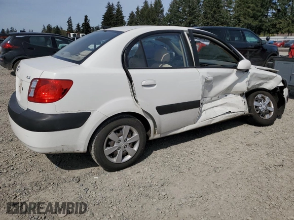2009 Kia Rio LX with VIN KNADE223896456292, listed as a Copart auction lot 54990605 with 61,220 mi miles and Salvage Title. Bid and sale history available at DreamBid. Image 3.