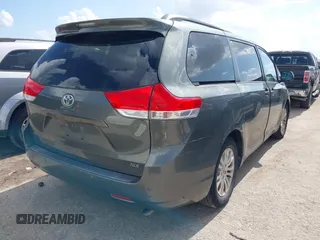 2014 Toyota Sienna XLE with VIN 5TDYK3DC2ES448876, listed as a IAAI auction lot 42519351 with 154,601 mi miles and . Bid and sale history available at DreamBid. Image 4.