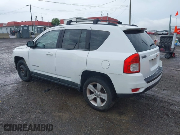 2011 Jeep Compass Latitude with VIN 1J4NT1FB1BD192076, listed as a IAAI auction lot 42121930 with 148,548 mi miles. Bid and sale history available at carsss.com. Image 3.