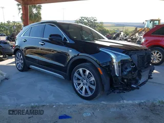 2020 Cadillac XT4 FWD Premium Luxury with VIN 1GYFZCR42LF144359, listed as a IAAI auction lot 42012677 with 34,490 mi miles and . Bid and sale history available at carsss.com. Image 1.