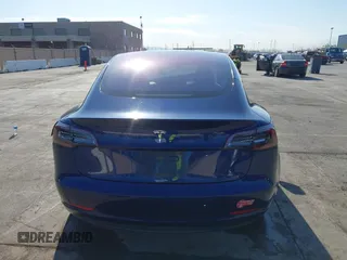 2018 Tesla Model 3 Long Range Battery with VIN 5YJ3E1EA4JF011799, listed as a IAAI auction lot 41765860 with 133,098 mi miles. Bid and sale history available at carsss.com. Image 16.