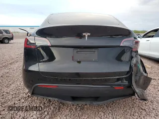2025 Tesla Model Y Long Range z VIN 7SAYGDED9SF313959, wystawiony jako Copart lot #52823755 z przebiegiem 1 137 mil mil oraz Szkoda całkowita • Salvage title. Historia ofert i sprzedaży dostępna na DreamBid. Obrazek 6.