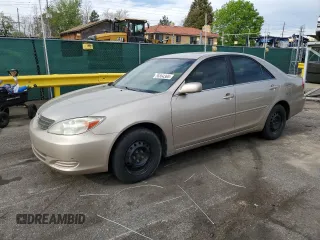 2002 Toyota Camry LE z VIN 4T1BE32K92U524457, wystawiony jako Copart lot #56864365 z przebiegiem 274 760 mil mil oraz Czysty tytuł • Clean title. Historia ofert i sprzedaży dostępna na DreamBid. Obrazek 1.