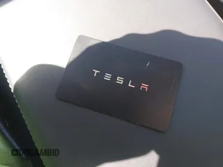 2023 Tesla Model 3 Long Range with VIN 5YJ3E1EB9PF393622, listed as a IAAI auction lot 41207132 with 14,097 mi miles and . Bid and sale history available at DreamBid. Image 11.