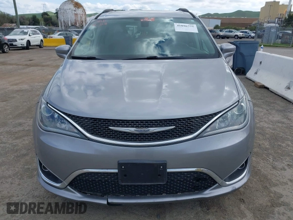 2017 Chrysler Pacifica Touring L with VIN 2C4RC1BG1HR803027, listed as a IAAI auction lot 41896775 with 112,896 mi miles and . Bid and sale history available at DreamBid. Image 12.