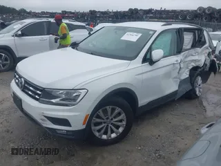 2018 Volkswagen Tiguan S with VIN 3VV1B7AX1JM032250, listed as a IAAI auction lot 42366790 with 65,406 mi miles and . Bid and sale history available at DreamBid. Image 2.