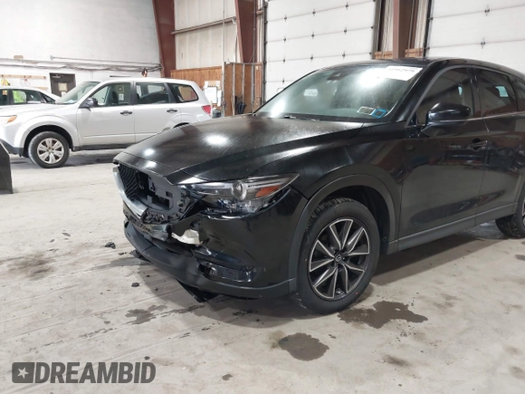 2017 Mazda CX-5 Grand Touring with VIN JM3KFBDL6H0143013, listed as a IAAI auction lot 41912979 with 122,890 mi miles. Bid and sale history available at carsss.com. Image 17.
