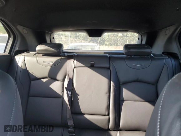 2021 Cadillac XT4 FWD Luxury z VIN 1GYAZAR49MF081955, wystawiony jako Copart lot #76611074 z przebiegiem 34 635 mil mil oraz Szkoda całkowita • Salvage title. Historia ofert i sprzedaży dostępna na DreamBid. Obrazek 10.