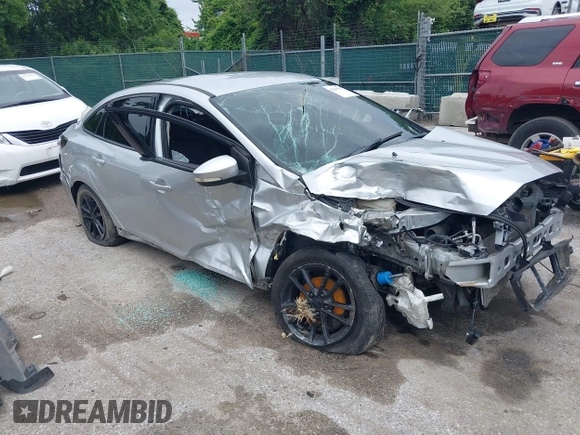 2016 Ford Focus SE z VIN 1FADP3F22GL373756, wystawiony jako IAAI lot #42369795 z przebiegiem 99 646 mil mil oraz . Historia ofert i sprzedaży dostępna na DreamBid. Obrazek 1.
