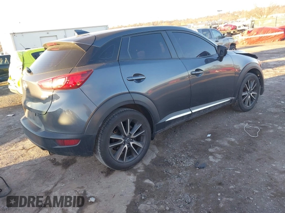 2016 Mazda CX-3 Grand Touring with VIN JM1DKBD74G0115936, listed as a IAAI auction lot 41296104 with 191,408 mi miles. Bid and sale history available at carsss.com. Image 4.