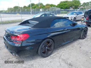 2014 BMW M6 z VIN WBSLZ9C52EDZ78748, wystawiony jako IAAI lot #42152435 z przebiegiem 57 150 mil mil oraz . Historia ofert i sprzedaży dostępna na DreamBid. Obrazek 4.