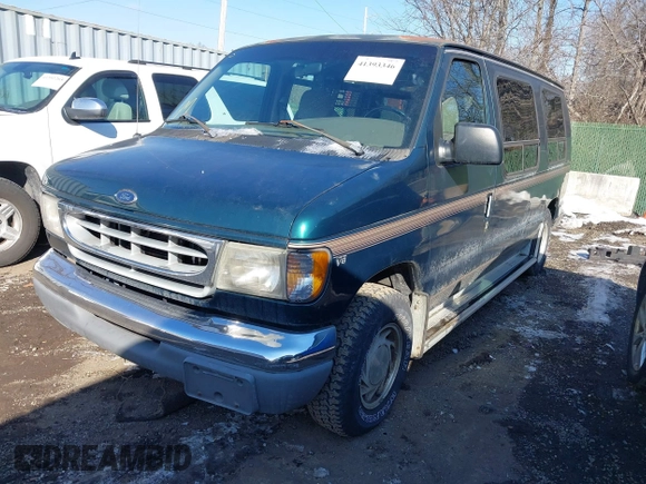 1999 Ford Econoline Cargo with VIN 1FDRE14W3XHB36482, listed as a IAAI auction lot 41393346 with 130,669 mi miles. Bid and sale history available at carsss.com. Image 17.