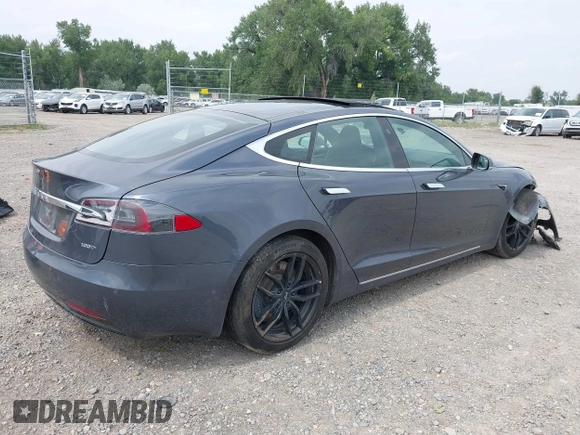 2019 Tesla Model S 75D with VIN 5YJSA1E22KF300407, listed as a IAAI auction lot 40034839 with 59,178 mi miles and . Bid and sale history available at DreamBid. Image 4.