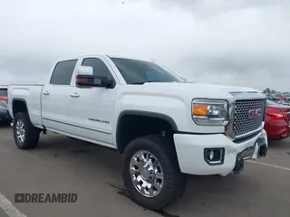 2016 GMC Sierra 2500HD Denali z VIN 1GT12UE89GF172877, wystawiony jako IAAI lot #41807741 z przebiegiem 36 719 mil mil oraz . Historia ofert i sprzedaży dostępna na DreamBid. Obrazek 1.