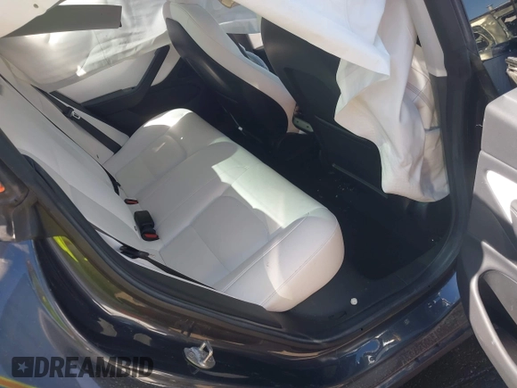 2018 Tesla Model 3 Long Range Battery with VIN 5YJ3E1EBXJF055203, listed as a IAAI auction lot 42019770 with 57,379 mi miles and . Bid and sale history available at DreamBid. Image 8.