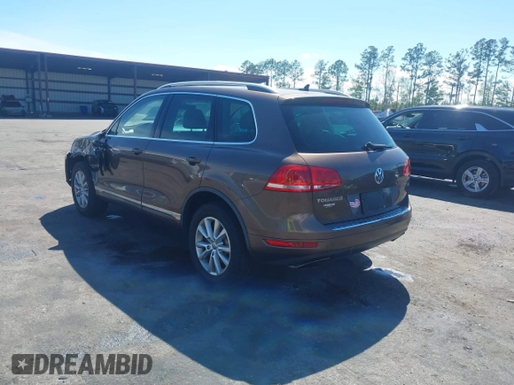 2014 Volkswagen Touareg Sport with VIN WVGEF9BP7ED003525, listed as a IAAI auction lot 41868307 with 74,379 mi miles and . Bid and sale history available at DreamBid. Image 3.