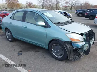 2009 Toyota Yaris with VIN JTDBT903794060474, listed as a IAAI auction lot 42005903 with 104,607 mi miles. Bid and sale history available at carsss.com. Image 1.