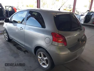 2009 Toyota Yaris with VIN JTDJT903095254673, listed as a IAAI auction lot 41830459 with 320,449 mi miles. Bid and sale history available at carsss.com. Image 3.