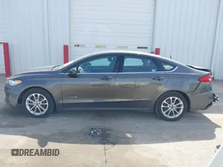 2019 Ford Fusion Hybrid SE with VIN 3FA6P0LU6KR163927, listed as a IAAI auction lot 41834612 with 104,342 mi miles. Bid and sale history available at carsss.com. Image 15.