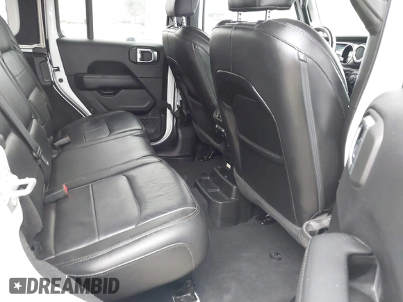2023 Jeep Wrangler Sahara with VIN 1C4HJXEG5PW581632, listed as a IAAI auction lot 42462622 with 24,550 mi miles and . Bid and sale history available at DreamBid. Image 8.