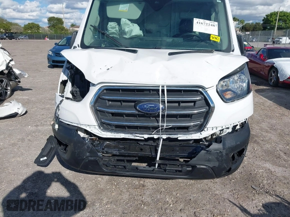 2021 Ford Transit Cargo with VIN 1FTBW3X8XMKA14051, listed as a IAAI auction lot 41672248 with 127,438 mi miles. Bid and sale history available at carsss.com. Image 6.