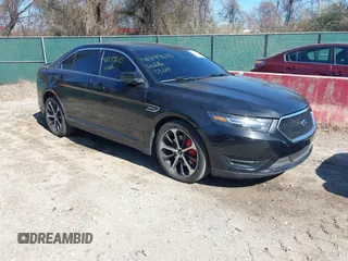 2014 Ford Taurus SHO with VIN 1FAHP2KT0EG164404, listed as a IAAI auction lot 41899695 with 157,077 mi miles. Bid and sale history available at carsss.com. Image 1.