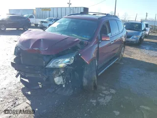 2015 Chevrolet Traverse LT with VIN 1GNKRGKD5FJ101424, listed as a IAAI auction lot 41211081 with 130,639 mi miles. Bid and sale history available at carsss.com. Image 2.