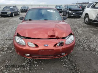 1999 Ford Escort Cool z VIN 3FAKP1135XR110190, wystawiony jako Copart lot #83667154 z przebiegiem 82 448 mil mil oraz Szkoda całkowita • Salvage title. Historia ofert i sprzedaży dostępna na DreamBid. Obrazek 5.