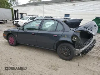 2002 Saturn SL z VIN 1G8ZH52842Z201392, wystawiony jako Copart lot #56595105 z przebiegiem Nie podano mil oraz Szkoda całkowita • Salvage title. Historia ofert i sprzedaży dostępna na DreamBid. Obrazek 2.