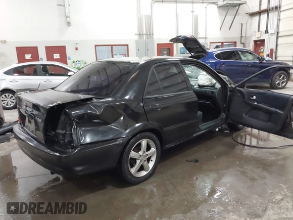 2003 Mazda Protege DX with VIN JM1BJ226431112902, listed as a IAAI auction lot 41939907 with 184,618 mi miles and . Bid and sale history available at DreamBid. Image 4.
