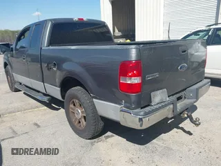 2005 Ford F-150 XLT with VIN 1FTPX12575NA22872, listed as a IAAI auction lot 41532157 with 261,093 mi miles. Bid and sale history available at carsss.com. Image 3.