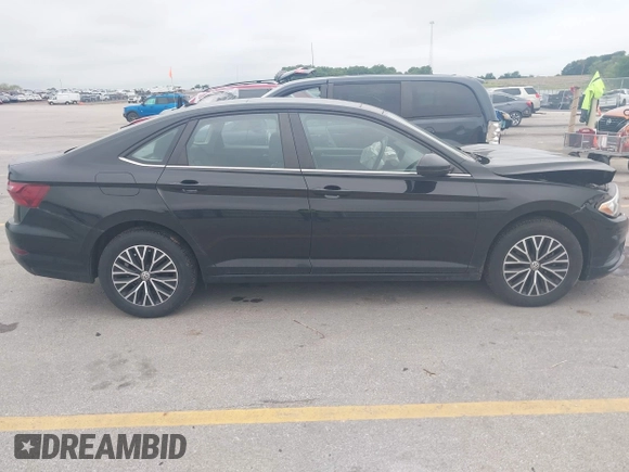 2021 Volkswagen Jetta S z VIN 3VWC57BU5MM008733, wystawiony jako IAAI lot #42527371 z przebiegiem 76 548 mil mil oraz . Historia ofert i sprzedaży dostępna na DreamBid. Obrazek 13.