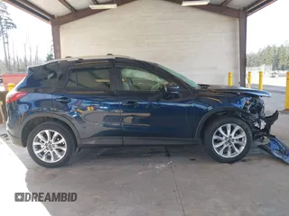 2014 Mazda CX-5 Grand Touring with VIN JM3KE2DY6E0394172, listed as a IAAI auction lot 41698468 with 89,554 mi miles. Bid and sale history available at carsss.com. Image 13.