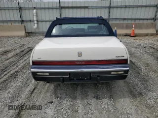 1987 Oldsmobile Toronado with VIN 1G3EZ1130HU307201, listed as a Copart auction lot 49290815 with 104,837 mi miles and Salvage Title. Bid and sale history available at DreamBid. Image 6.