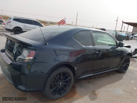 2016 Scion tC with VIN JTKJF5C76GJ017584, listed as a IAAI auction lot 41938981 with 121,166 mi miles. Bid and sale history available at carsss.com. Image 13.