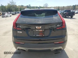 2021 Cadillac XT4 FWD Premium Luxury z VIN 1GYFZCR48MF002468, wystawiony jako Copart lot #50878955 z przebiegiem 76 034 mil mil oraz Szkoda całkowita • Salvage title. Historia ofert i sprzedaży dostępna na DreamBid. Obrazek 6.
