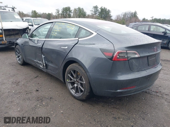 2019 Tesla Model 3 Mid Range with VIN 5YJ3E1EA3KF307415, listed as a IAAI auction lot 41673239 with 42,895 mi miles and . Bid and sale history available at DreamBid. Image 3.