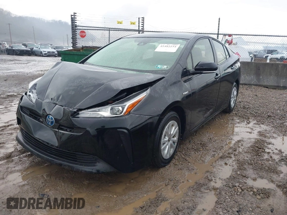 2021 Toyota Prius L Eco with VIN JTDKAMFU5M3145210, listed as a IAAI auction lot 41482234 with 85,600 mi miles and . Bid and sale history available at DreamBid. Image 2.