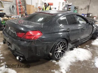 2014 BMW 6 Series 650i xDrive with VIN WBA6B4C56ED760482, listed as a IAAI auction lot 41384990 with 64,863 mi miles. Bid and sale history available at carsss.com. Image 4.