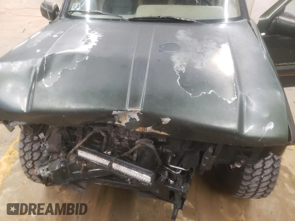 1995 Jeep Grand Cherokee Limited z VIN 1J4GZ78S7SC766726, wystawiony jako Copart lot #84909134 z przebiegiem 174 256 mil mil oraz Szkoda całkowita • Salvage title. Historia ofert i sprzedaży dostępna na DreamBid. Obrazek 13.