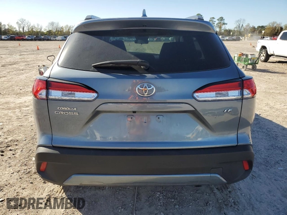 2023 Toyota Corolla Cross LE with VIN 7MUCAAAG8PV060228, listed as a Copart auction lot 86827224 with 40,395 mi miles and Salvage title. Bid and sale history available at DreamBid. Image 6.