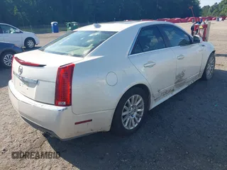 2010 Cadillac CTS Luxury with VIN 1G6DE5EG9A0118042, listed as a IAAI auction lot 42448076 with 142,359 mi miles and . Bid and sale history available at DreamBid. Image 4.