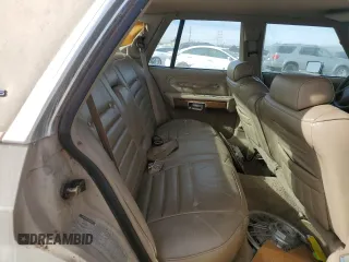 1991 Mercury Grand Marquis z VIN 2MECM75FXMX633893, wystawiony jako Copart lot #87439324 z przebiegiem 65 046 mil mil oraz Tytuł czysty. Historia ofert i sprzedaży dostępna na DreamBid. Obrazek 10.