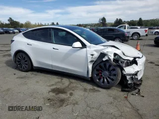 2022 Tesla Model Y Performance с VIN 7SAYGDEF2NF405596, выставлен на аукционе Copart как лот 52868195 с пробегом Не указан миль и Списание • Salvage title. История ставок и продаж доступна на DreamBid. Изображение 4.