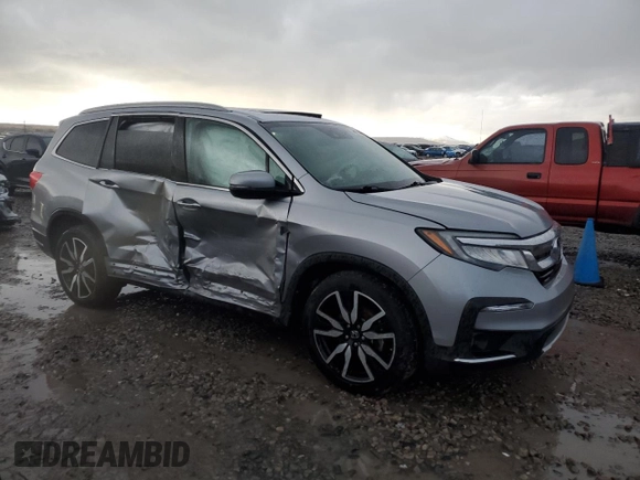 2020 Honda Pilot Touring 8-Passenger with VIN 5FNYF6H9XLB042625, listed as a Copart auction lot 86412804 with 52,061 mi miles and Salvage Title. Bid and sale history available at DreamBid. Image 4.