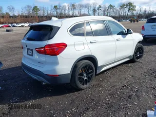 2018 BMW X1 xDrive28i with VIN WBXHT3C34J5L29714, listed as a IAAI auction lot 41825126 with 89,970 mi miles. Bid and sale history available at carsss.com. Image 4.