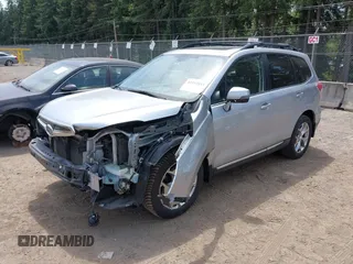 2015 Subaru Forester Touring with VIN JF2SJAWC6FH546472, listed as a IAAI auction lot 42513843 with 107,951 mi miles and . Bid and sale history available at DreamBid. Image 2.