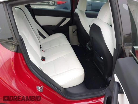 2018 Tesla Model 3 Long Range Battery with VIN 5YJ3E1EB7JF055384, listed as a IAAI auction lot 41924325 with 52,039 mi miles and . Bid and sale history available at DreamBid. Image 8.