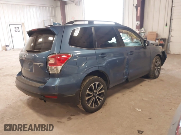 2018 Subaru Forester Premium with VIN JF2SJGECXJH606668, listed as a IAAI auction lot 41879710 with 64,910 mi miles. Bid and sale history available at carsss.com. Image 4.